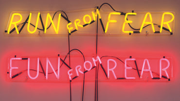 Run from Fear, Fun from Rear, 1972, neon tubing with clear glass tubing suspension frame, two parts: 20.3 x 116.8 x 5.7 cm (8 x 46 x 2 ¼ in) / 18.4 x 113 x 5.7 cm (71/4 x 44 ½ x 2/4 in), private collection, Switzerland, courtesy Hauser & Wirth.